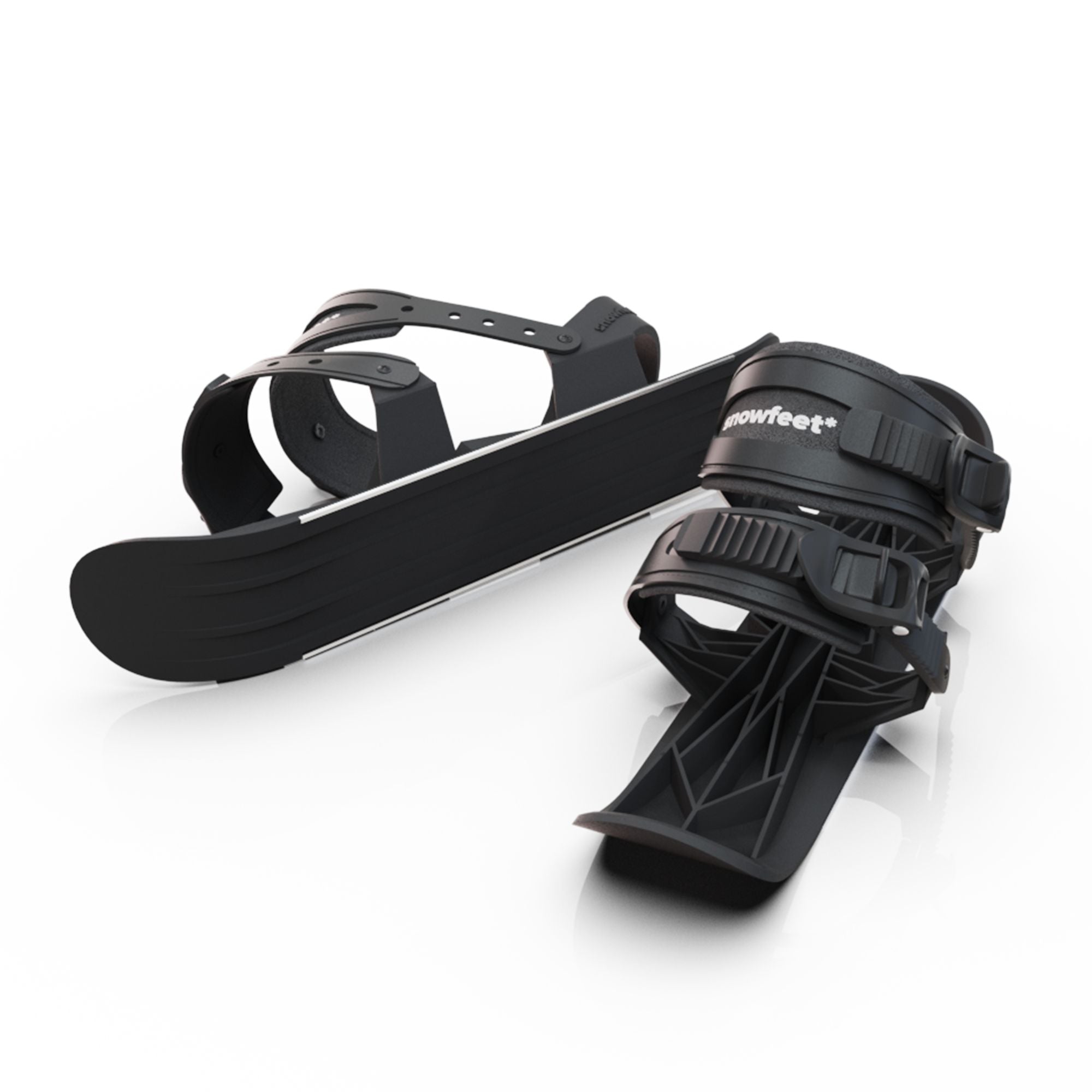 Black snowboard bindings on a white background