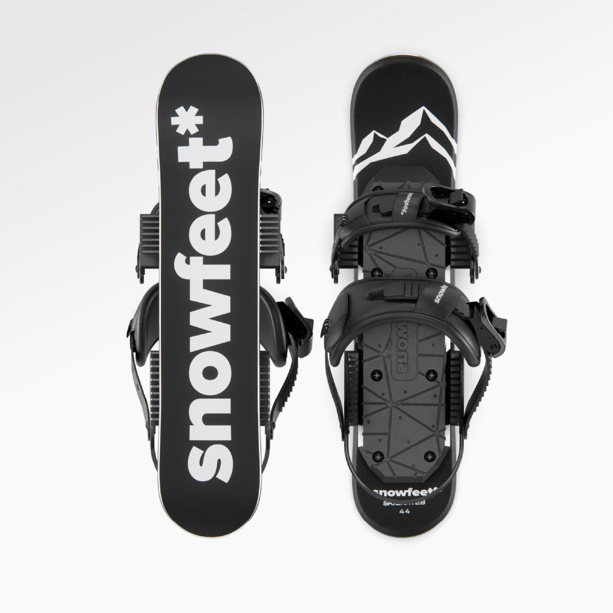 Black short skis with 'snowfeet' branding on a white background