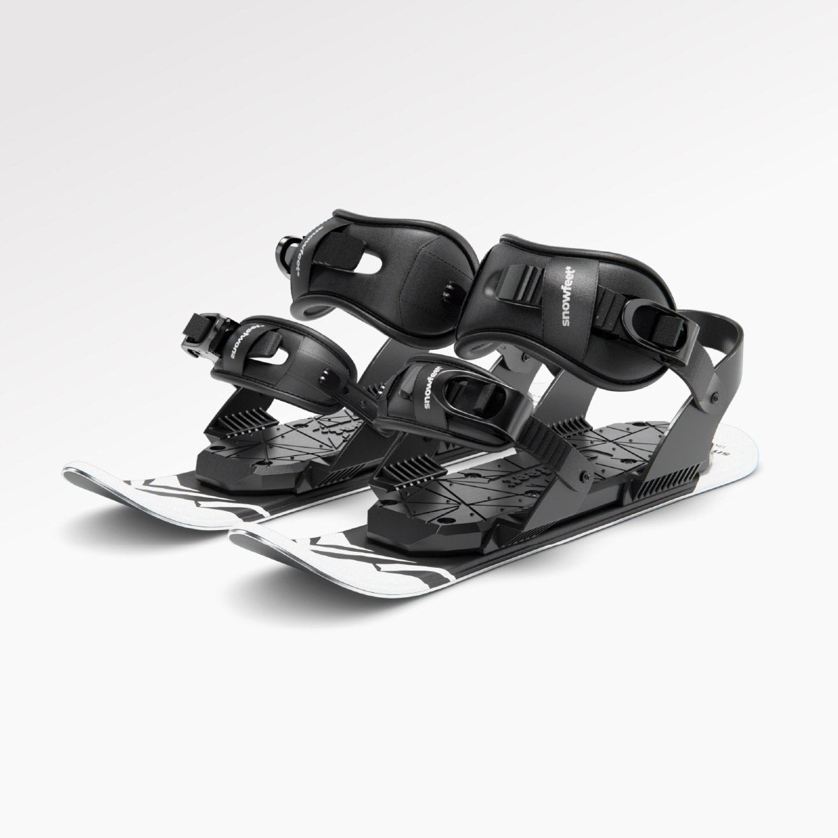 Pair of skiskates with snowboard bindings on a white background