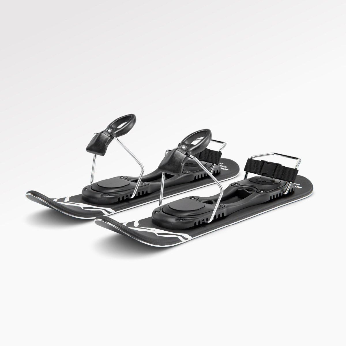 Pair of black short ski with ski boots bindings on a white background